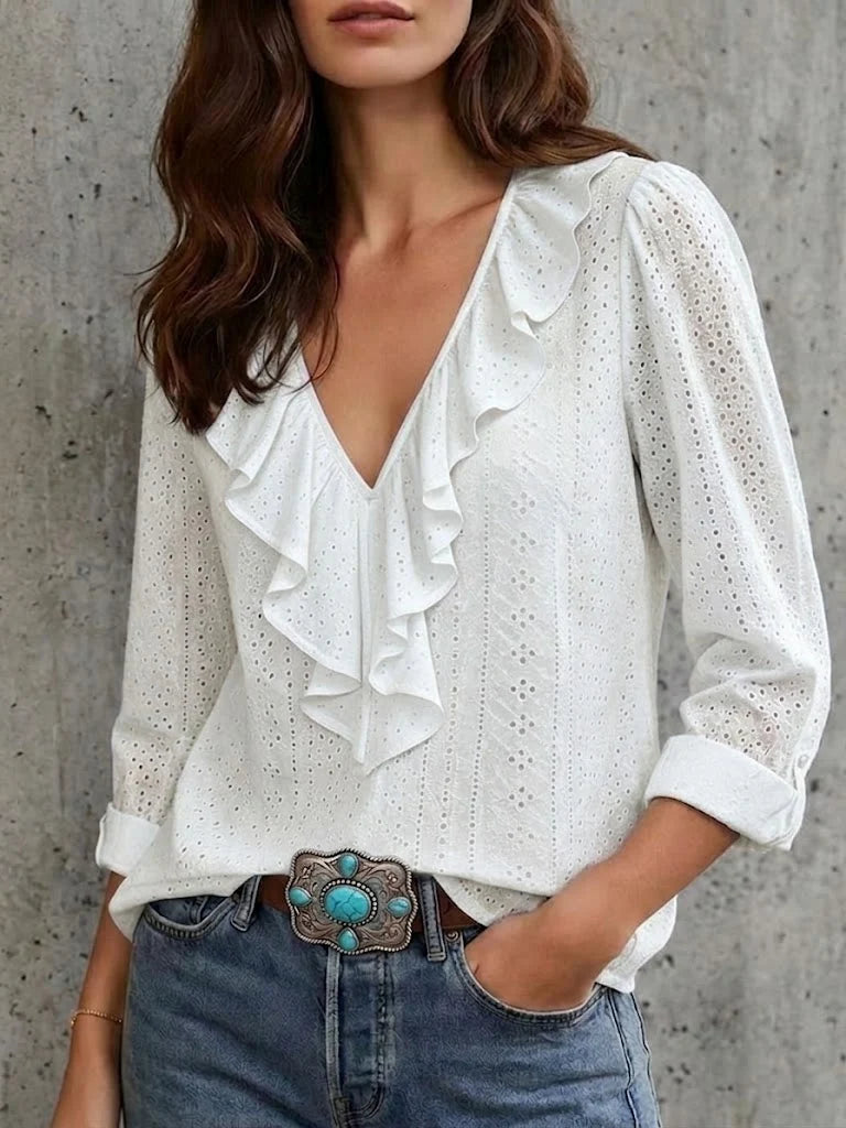 Jackeline - Un versatile top a maniche lunghe con scollo a V e volant, in tinta unita.